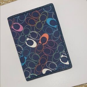 Coach 

Black with Multicolor Signature Pattern Passport/Card Holder